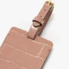 Bagagetag i rosa läder med krokodilprägling