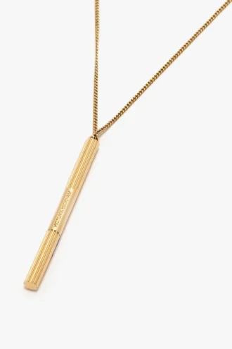 Halsband med manschettknapp i ljusguld